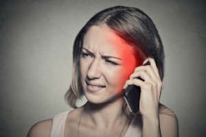woman feeling pain from cell phone