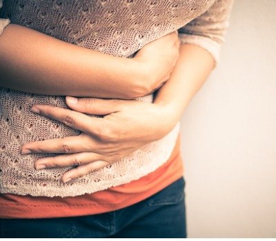 young woman with stomach pains